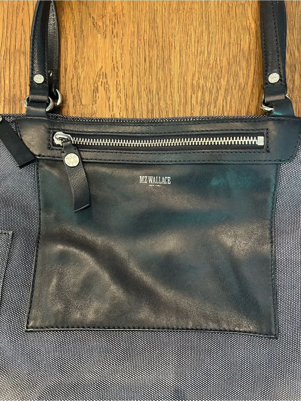 MZ Wallace navy canvas tote with leather pocket and handles